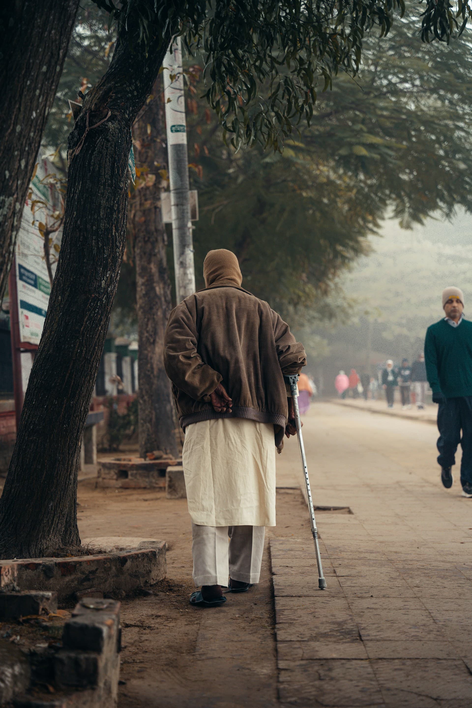 Old man with walking stick